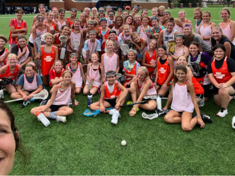 Xcelerate-lacrosse-girls-group-shot-coach